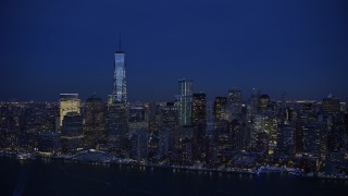 AX66_0384E - 4.8K aerial stock footage approach and orbit One World Trade Center in winter, New York City, twilight