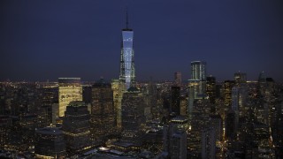 AX66_0386 - 4.8K aerial stock footage approach One World Trade Center in winter, New York City, twilight