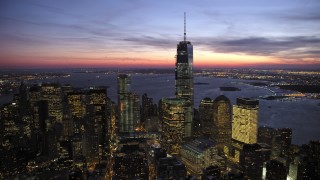 AX66_0390 - 4.8K aerial stock footage of a reverse view of One World Trade Center in winter, New York City, twilight