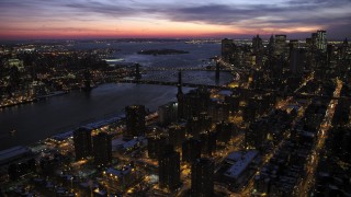 AX66_0394 - 4.8K aerial stock footage of Manhattan and Brooklyn Bridges in winter, New York City, twilight