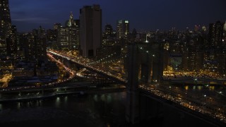 AX66_0405 - 4.8K aerial stock footage of the Brooklyn Bridge in winter, New York City, night