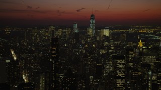 AX66_0428 - 4.8K stock footage aerial video of Lower Manhattan skyscrapers seen from Chrysler Building, New York City, night