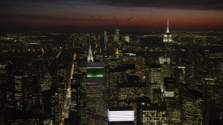 AX66_0438 - 4.8K stock footage aerial video of Empire State and Chrysler Buildings, and Lower Manhattan, New York City, night