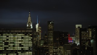 AX66_0443 - 4.8K aerial stock footage of Chrysler Building in Midtown Manhattan, New York City, night