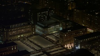 AX67_0008 - 4.8K aerial stock footage view of Lerner Hall and snowy campus at Columbia University at night, New York City, New York