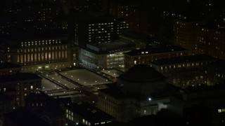 AX67_0009 - 4.8K aerial stock footage view approach Library and Lerner Hall at snowy Columbia University at night, New York City, New York