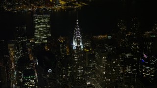 AX67_0020 - 4.8K aerial stock footage view top of the Chrysler Building at night in Midtown Manhattan, New York City, New York