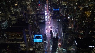 AX67_0028 - 4.8K aerial stock footage view follow 7th Avenue to approach Times Square at night, Midtown Manhattan, New York City, New York