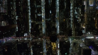 AX67_0030 - 4.8K aerial stock footage view of bird's eye view of city streets in Midtown Manhattan at night, New York City, New York