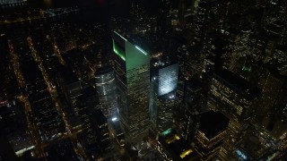 AX67_0037 - 4.8K aerial stock footage view of Citigroup Center at night in Midtown Manhattan, New York City, New York