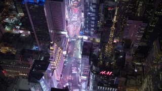 AX67_0044 - 4.8K aerial stock footage view of looking down on Times Square at night, Midtown Manhattan, New York City, New York