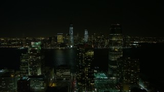 AX67_0071 - 4.8K aerial stock footage view of World Trade Center and Freedom Tower seen from Goldman Sachs Tower at night, New York