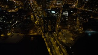 AX67_0079 - 4.8K aerial stock footage view of orbiting Manhattan Bridge at night, New York