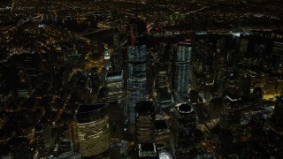 AX67_0086 - 4.8K aerial stock footage view of orbiting One World Trade Center in Lower Manhattan at night, New York
