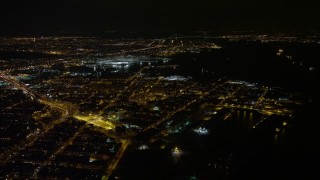 AX67_0098 - 4.8K aerial stock footage view of flying by Red Hook area of Brooklyn at night, New York