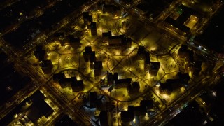 AX67_0105 - 4.8K aerial stock footage view of flying by Brooklyn projects at night, New York