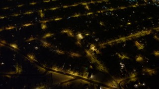 AX67_0114 - 4.8K aerial stock footage view of a bird's eye view of residential neighborhoods in Queens at night, New York