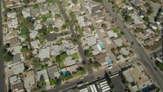 AX68_002 - 4.8K aerial stock footage bird's eye view of suburban homes, revealing I-5 and street intersection in Sun Valley, California