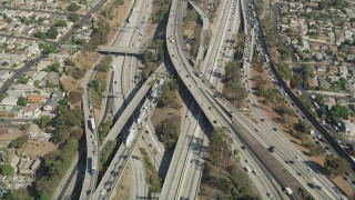 AX68_029 - 4.8K stock footage aerial video of a bird's eye view of heavy traffic on the East Los Angeles Interchange through Boyle Heights, Los Angeles, California
