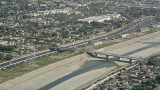 AX68_038 - 4.8K aerial stock footage approach the Los Angeles River and Interstate 710 in Bell Gardens, Los Angeles, California