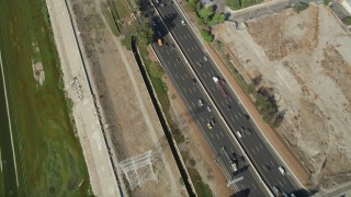 AX68_043 - 4.8K aerial stock footage of a bird's eye view of light traffic on I-710 through South Gate, Los Angeles, California