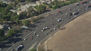 AX68_045 - 4.8K aerial stock footage of light traffic on Interstate 710 through South Gate, Los Angeles, California