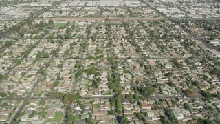 AX68_046 - 4.8K aerial stock footage of suburban neighborhoods by Somerset Boulevard in Paramount, Los Angeles, California
