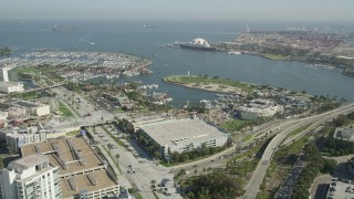 AX68_052 - 4.8K stock footage aerial video approach Rainbow Harbor, aquarium, and the Queen Mary in Long Beach, California