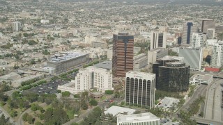 AX68_054 - 4.8K aerial stock footage of hotel and office buildings on Ocean Boulevard in Downtown Long Beach, California