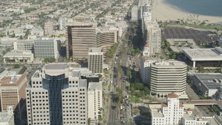 AX68_057 - 4.8K aerial stock footage of Ocean Boulevard lined with office buildings by Westin Long Beach in Downtown Long Beach, California