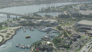 AX68_060 - 4.8K aerial stock footage of Aquarium of the Pacific and boats on Rainbow Harbor in Downtown Long Beach, California