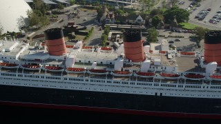 AX68_066 - 4.8K aerial stock footage of starboard side of the RMS Queen Mary in Long Beach, California
