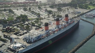 AX68_067 - 4.8K aerial stock footage flyby the RMS Queen Mary docked in Long Beach, California
