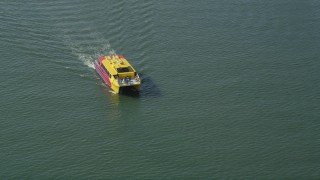 AX68_074 - 4.8K aerial stock footage of ferry slowly sailing across San Pedro Bay, Long Beach, California