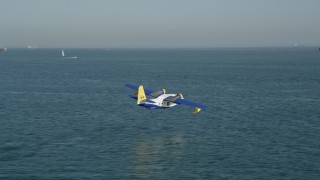 AX68_078 - 4.8K aerial stock footage track seaplane flying over San Pedro Bay in Long Beach, California