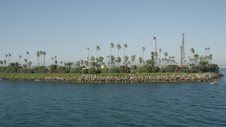 AX68_128 - 4.8K aerial stock footage flyby Island Chaffee oil drilling island in San Pedro Bay, Long Beach, California