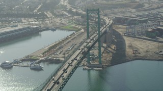 AX68_149 - 4.8K aerial stock footage fly over the Vincent Thomas Bridge at the Port of Los Angeles, California
