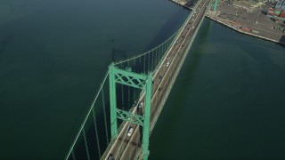 AX68_157 - 4.8K aerial stock footage of a bird's eye view of light traffic on the Vincent Thomas Bridge, California