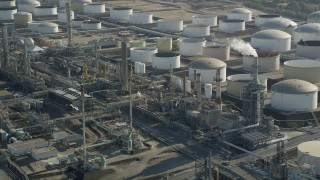 AX68_174 - 4.8K aerial stock footage of large tanks at Los Angeles Refinery Wilmington Plant in San Pedro, California