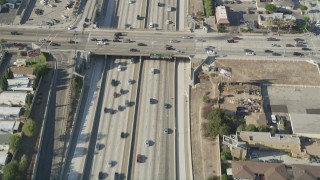 AX68_178 - 4.8K stock footage aerial video bird's eye view of cars traveling on Interstate 110 through Carson, California