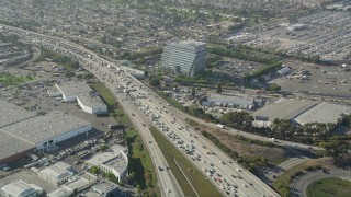 AX68_183 - 4.8K stock footage aerial video of heavy traffic on Interstate 405 through Torrance, California