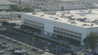 AX68_193 - 4.8K aerial stock footage of the SpaceX office building and Crenshaw Boulevard in Hawthorne, California