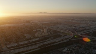 AX69_001 - 4.8K aerial stock footage of Los Angeles International Airport at sunset in California
