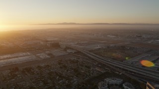 AX69_002 - 4.8K aerial stock footage of sunset at Los Angeles International Airport in California