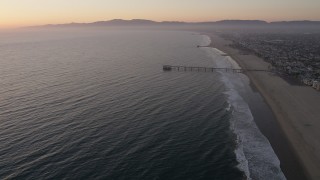 AX69_023 - 4.8K stock footage video approach Venice Fishing Pier on the California Coast at sunset