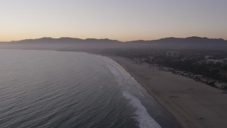 AX69_037 - 4.8K aerial stock footage approach Santa Monica State Beach, deserted at twilight, California