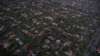 AX69_050 - 4.8K aerial stock footage fly over mansions and upscale homes at twilight in Brentwood, California