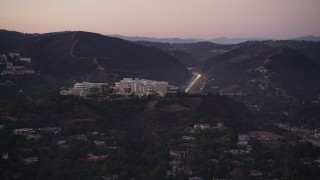 AX69_052 - 4.8K aerial stock footage of J. Paul Getty Museum in the hills above Brentwood at twilight, California
