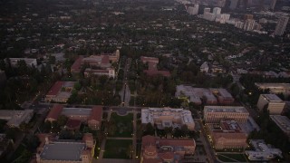AX69_059 - 4.8K aerial stock footage of flying over Dickson Court and buildings at the College campus at twilight, Westwood, California