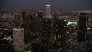 AX69_081 - 4.8K aerial stock footage approach skyscrapers at night in Downtown Los Angeles, California